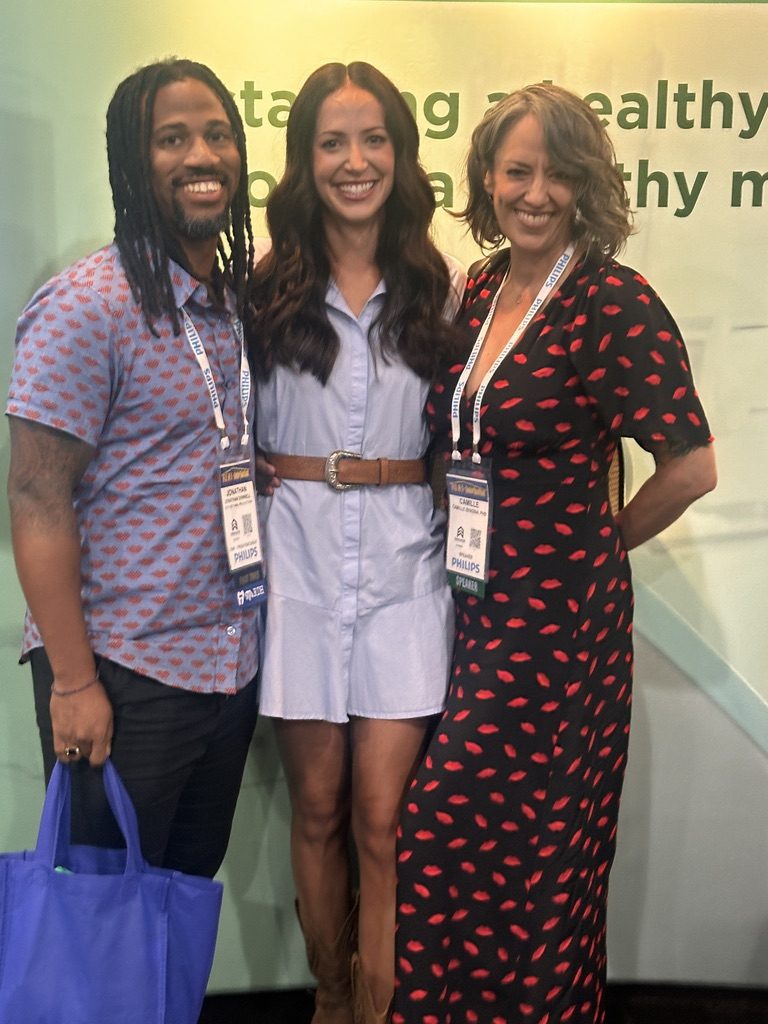 Camille with colleagues at a dental conference